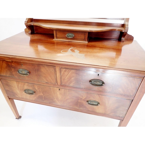 1076 - An Edwardian mahogany dressing table with swing mirror, two short over one long drawer, 114cm