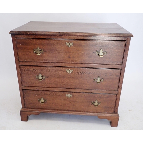 1099 - A 19th century oak Georgian style small chest of three drawers with brass handles and bracket suppor... 