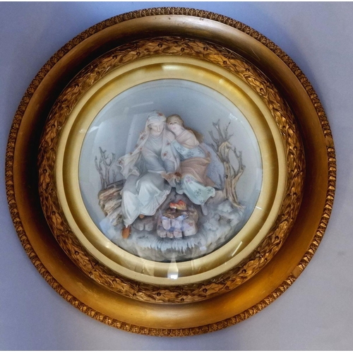 1100 - A Victorian bisque group of two women by a fire in convex glazed gilt circular frame, 49cm