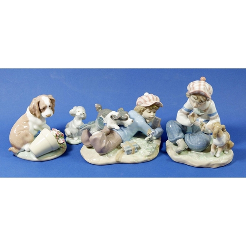 14 - Four Lladro figures, 5451 'Study Buddy' 7672 Dog with flower pot, boy with a dog and 7685 'Friend fo... 