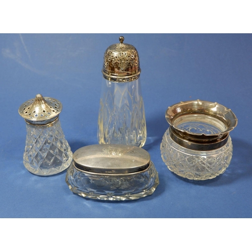191 - Two cut glass and silver sugar casters, a toiletry jar and silver toiletry box