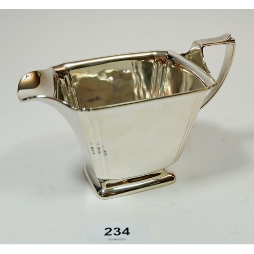 234 - An Art Deco silver milk jug, London 1935, 210g