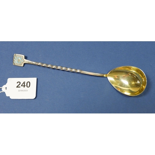 240 - A Russian silver caviar spoon with gilt bowl and enamel terminal, 916 standard, 15cm