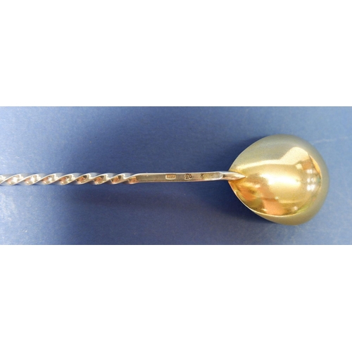 240 - A Russian silver caviar spoon with gilt bowl and enamel terminal, 916 standard, 15cm