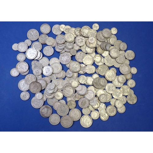 612 - A quantity of silver content British coinage pre 1947 including: sixpences, shillings, two shillings... 