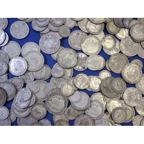 612 - A quantity of silver content British coinage pre 1947 including: sixpences, shillings, two shillings... 