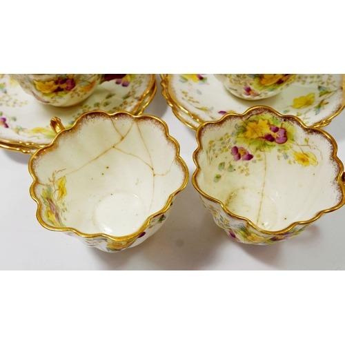 63 - An Edwardian Balmoral china tea service decorated flowers comprising twelve cups and saucers, tea pl... 