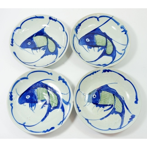 69 - A set of four Chinese dishes, printed fish, 20.5cm diameter