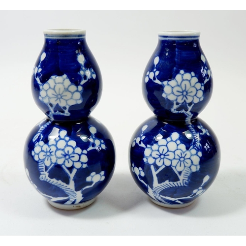 80 - A pair of 20th century Chinese prunus blossom double gourd vases, 12.5cm tall