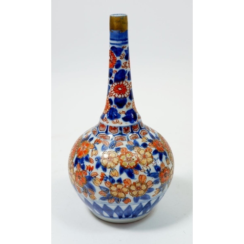 81 - A Japanese Imari bottle form vase with floral decoration, 19cm