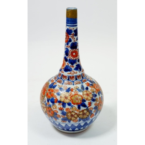 81 - A Japanese Imari bottle form vase with floral decoration, 19cm