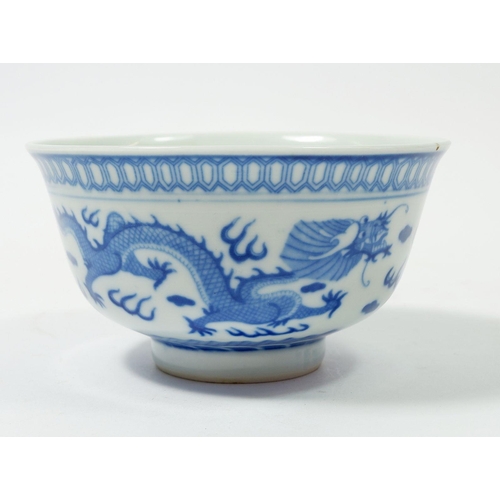 84 - A Chinese blue and white bowl decorated dragon, 12cm diameter