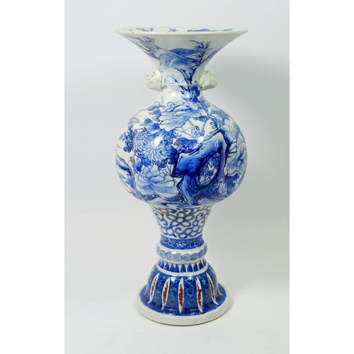 86 - A Japanese blue vase decorated floral landscape, mark to base, 33cm tall