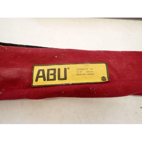 An Abu Legerlite 123 fishing rod 343cm, plus one other, a box of fishing  equipment and accessories