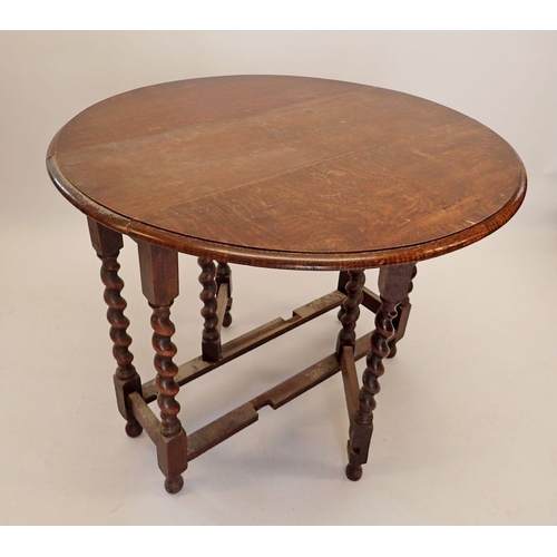 1187 - An oak oval dropleaf supper table on spiral turned supports, 92cm wide