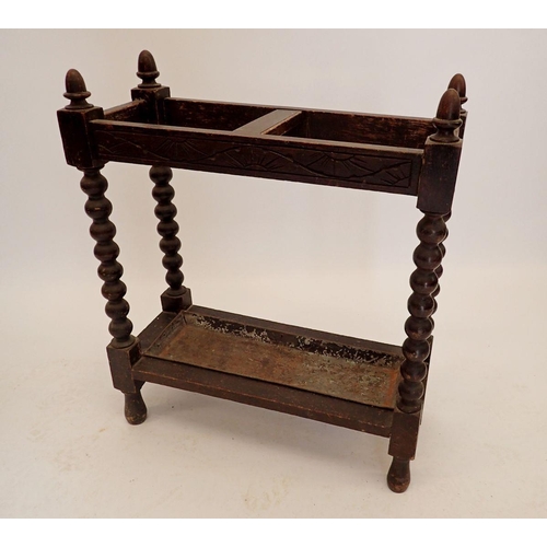 1190 - An oak stick stand on bobbin turned supports