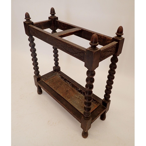 1190 - An oak stick stand on bobbin turned supports