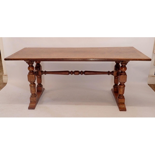 1194 - An early 20th century oak refectory style dining table on heavy turned supports, 75.5 x 183cm