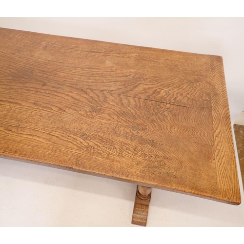 1194 - An early 20th century oak refectory style dining table on heavy turned supports, 75.5 x 183cm