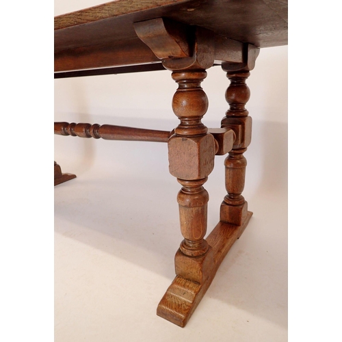 1194 - An early 20th century oak refectory style dining table on heavy turned supports, 75.5 x 183cm