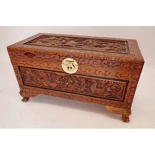 1197 - A Chinese carved small camphorwood chest, 86 x 42 x 49cm