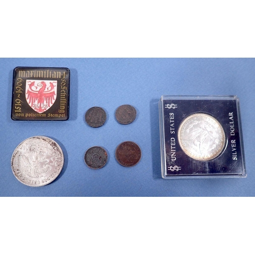 502 - A quantity of world coinage to include a cased US silver Morgan Dollar 1884, A Mexican silver Olympi... 