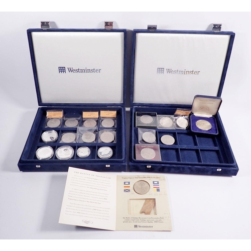 513 - Two Westminster presentation coin cases with a quantity of coins and commemoratives to include: Wind... 