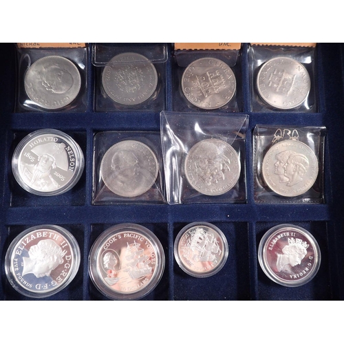 513 - Two Westminster presentation coin cases with a quantity of coins and commemoratives to include: Wind... 