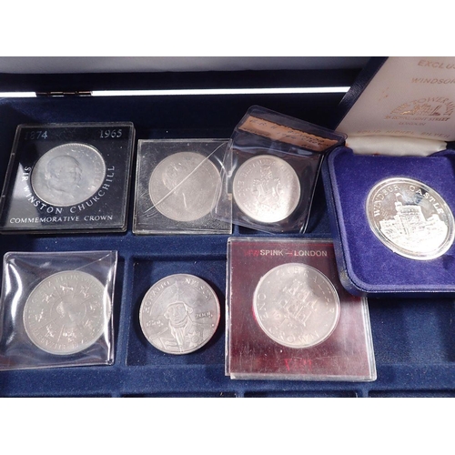 513 - Two Westminster presentation coin cases with a quantity of coins and commemoratives to include: Wind... 