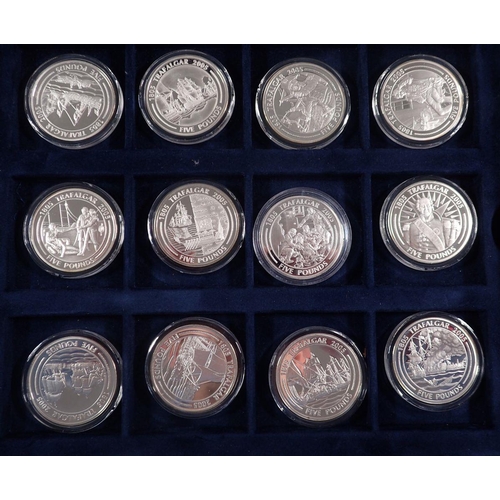 514 - A set of twenty four Trafalgar silver five pound coins, Gibraltar issue 2005 in a Westminster presen... 