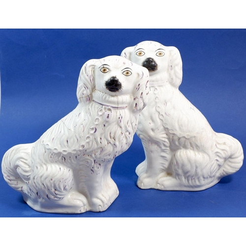 58 - A pair of 19th century Staffordshire dogs, one a/f, 26.5cm tall