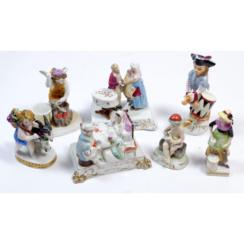 61 - A collection of 5 miniature porcelain figures and 2 fairing groups (7)