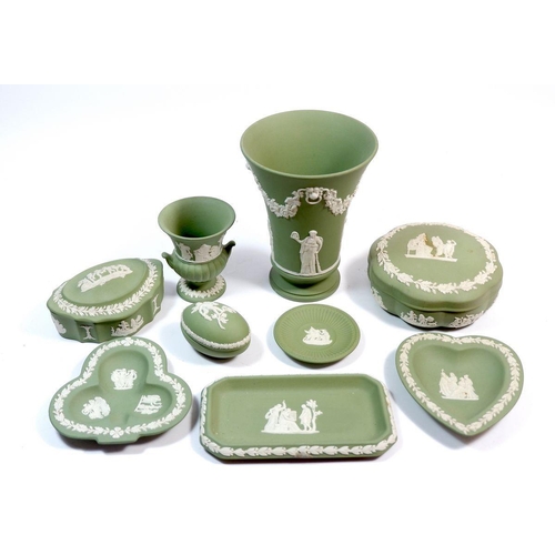 70 - A collection of nine Wedgwood green Jasperware items including trinket boxes and vase, 15.5cm tall