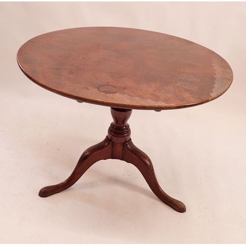 1103 - A Georgian mahogany tilt top circular occasional table on turned column and triple supports