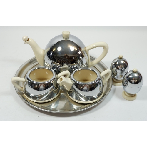 1112 - An 'Everhot' retro chrome clad teaset comprising: teapot, milk, sugar and two egg cups