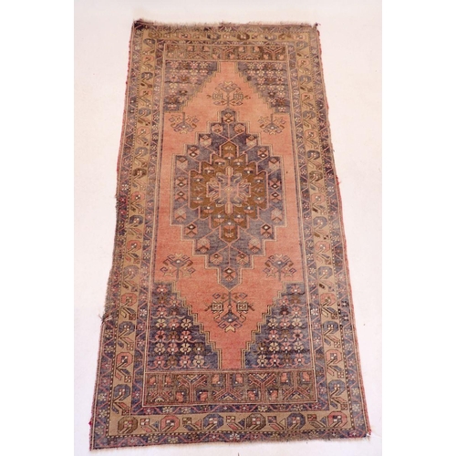 1129 - A Turkoman style rug with geometrical decoration on a blue ground 217x196cm