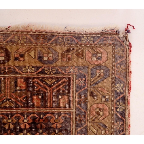 1129 - A Turkoman style rug with geometrical decoration on a blue ground 217x196cm