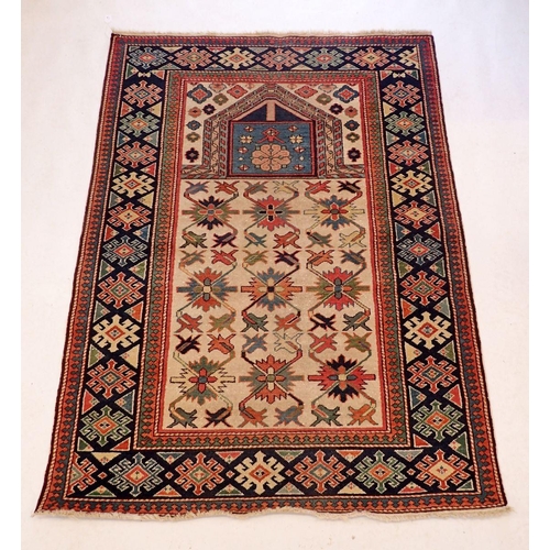 1130 - A Shirvan style Caucasian prayer rug with stylised floral motifs on a cream ground 147x109cm