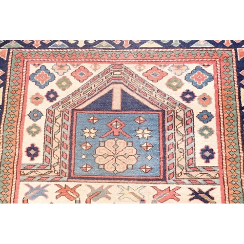 1130 - A Shirvan style Caucasian prayer rug with stylised floral motifs on a cream ground 147x109cm