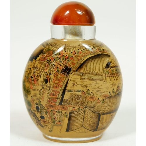 186A - A Chinese glass snuff bottle with agate lid, 8cm tall