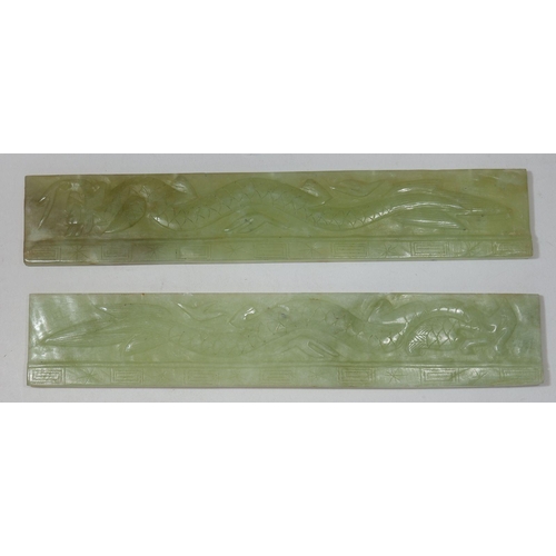 197 - Two 20th century Chinese jade panel paperweights decorated dragon and phoenix, 28 x 5cm