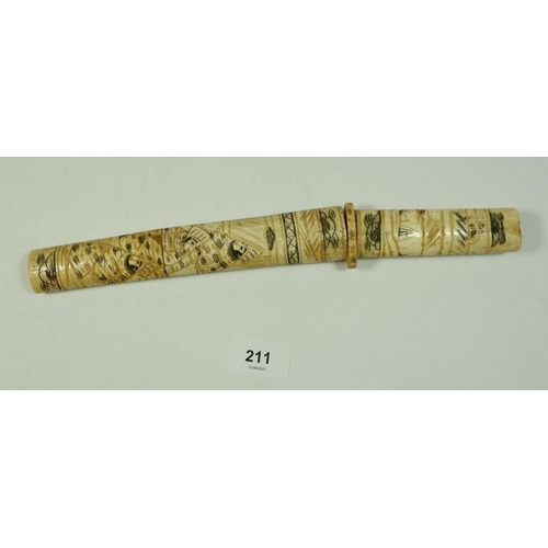 211 - A Japanese bone tanto with engraved decoration, 30cm long (lacking end piece)