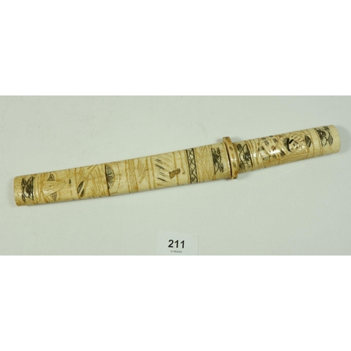 211 - A Japanese bone tanto with engraved decoration, 30cm long (lacking end piece)