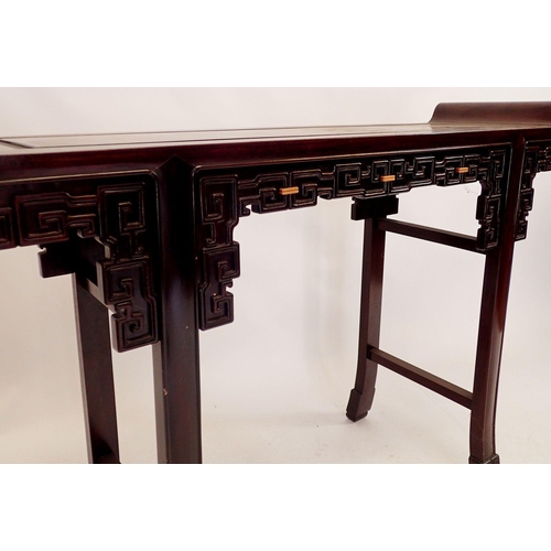 215 - A Chinese hardwood altar table with scroll over end and blind fretwork carved frieze, 125cm wide x 3... 