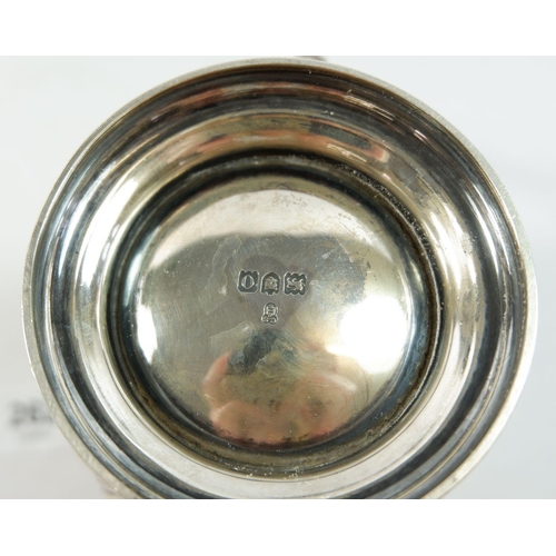 262 - A silver jug with half reeded decoration, 318g, London 1909 by C S Harris & Sons Ltd, 12.5cm
