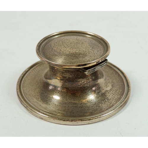 329 - A silver capstan inkwell, Birmingham 1928, 10cm diameter