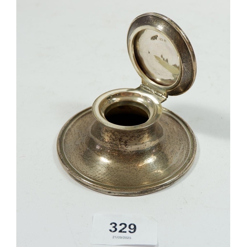 329 - A silver capstan inkwell, Birmingham 1928, 10cm diameter