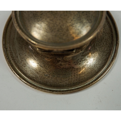 329 - A silver capstan inkwell, Birmingham 1928, 10cm diameter