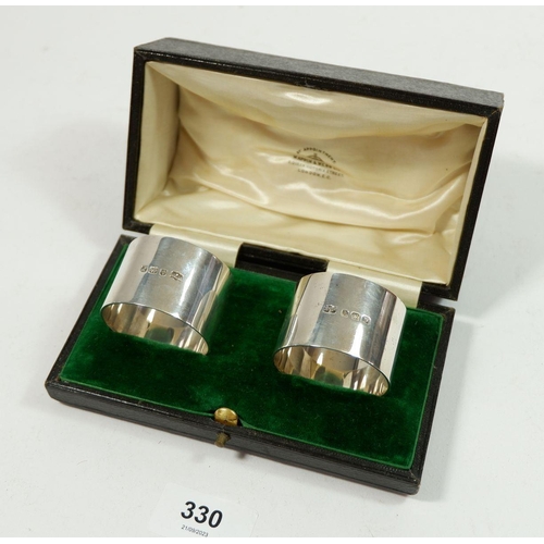 330 - A pair of heavy Mappin & Webb silver napkin rings - cased, Birmingham 1914, 118g