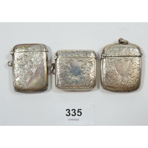 335 - Three silver engraved vesta cases, Birmingham 1898, 1906 and 1910
